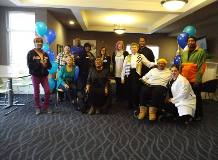 Residents of A Place For Us gather for a photo.